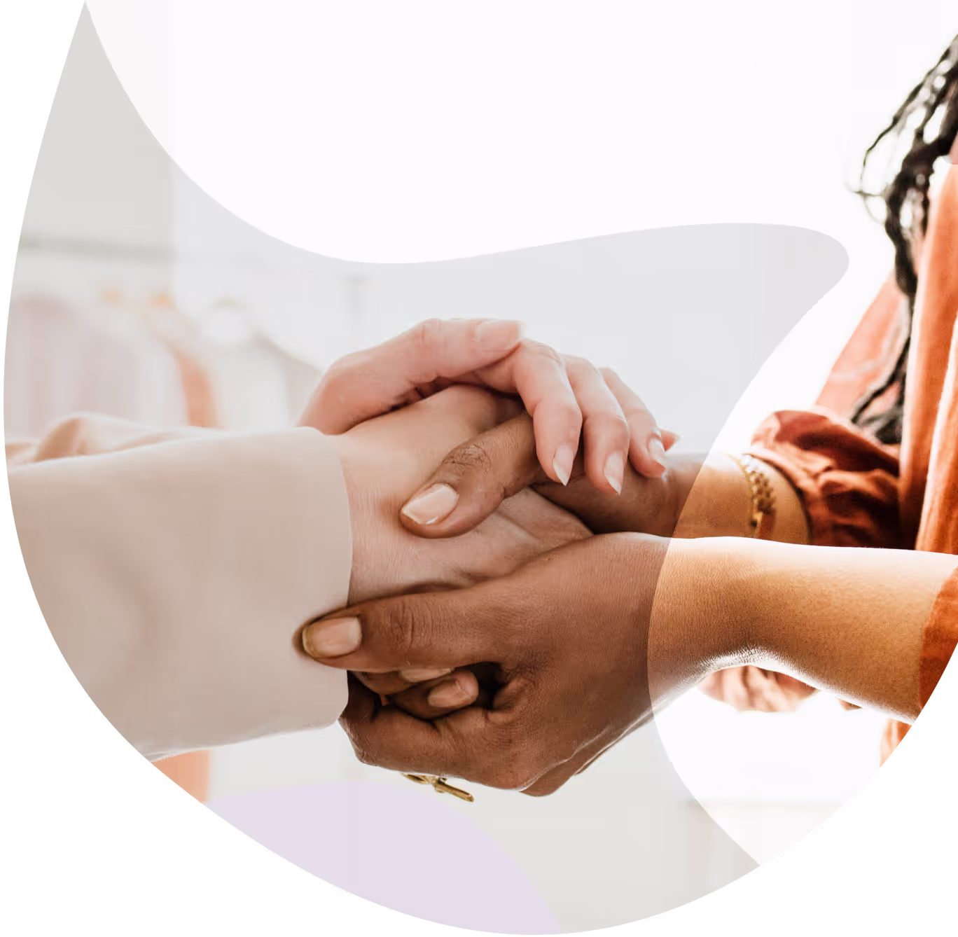 Women's hands resting together in support